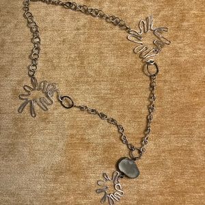 Hand crafted sterling and silver plated necklace with sea glass .